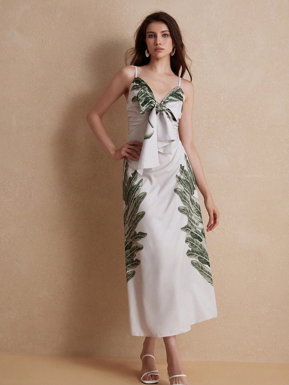 Experience the ultimate tropical paradise with our Beach Vacation Dress! Featuring bowknot shoulder straps, this dress will not only keep you stylish, but also comfortable during your beach getaway. Made from high-quality materials, it's the perfect addition to your vacation wardrobe.