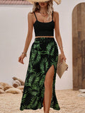 Escape to paradise with this stunning two-piece set featuring a tropical print skirt and solid cami top. The split thigh skirt showcases vibrant island-inspired patterns in multicolor, while the spaghetti strap camisole offers effortless elegance. Perfect for beach getaways, resort wear, or boho-inspired occasions, this set combines comfort with style. The semi-sheer cami pairs beautifully with the long skirt for a breezy, carefree look. Machine washable for easy care.