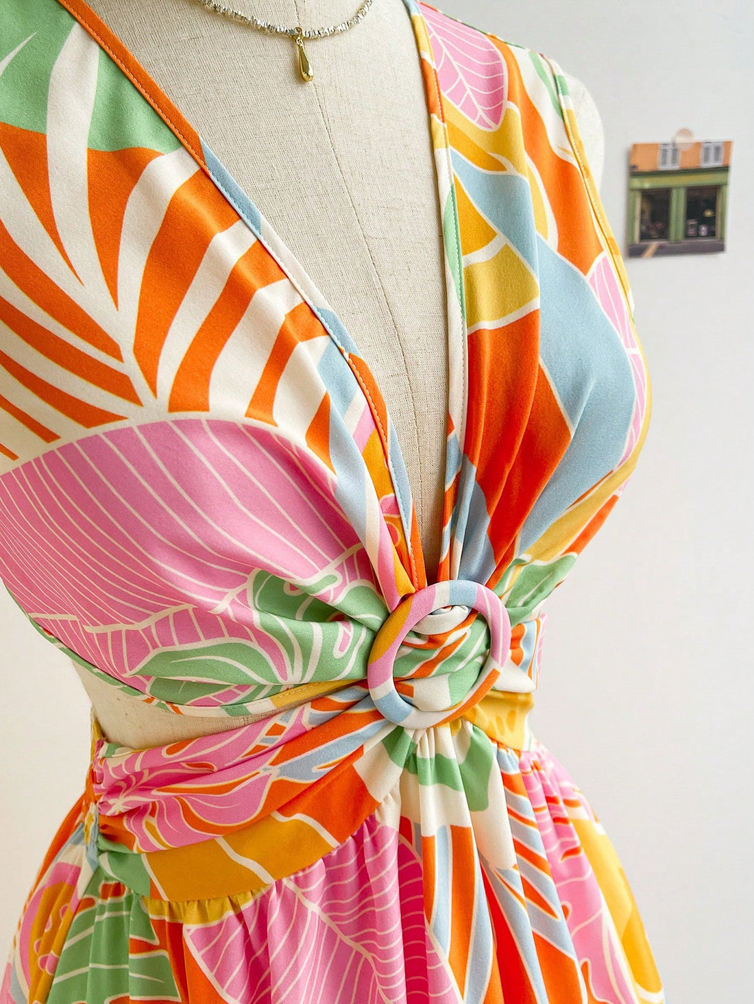 Get ready to embrace the tropical vibes with this vibrant women's V-neck dress! The playful A-line silhouette and open back add a flirty touch, while the eye-catching plant print will have you feeling like you're on vacation all year round. Say aloha to effortless style!