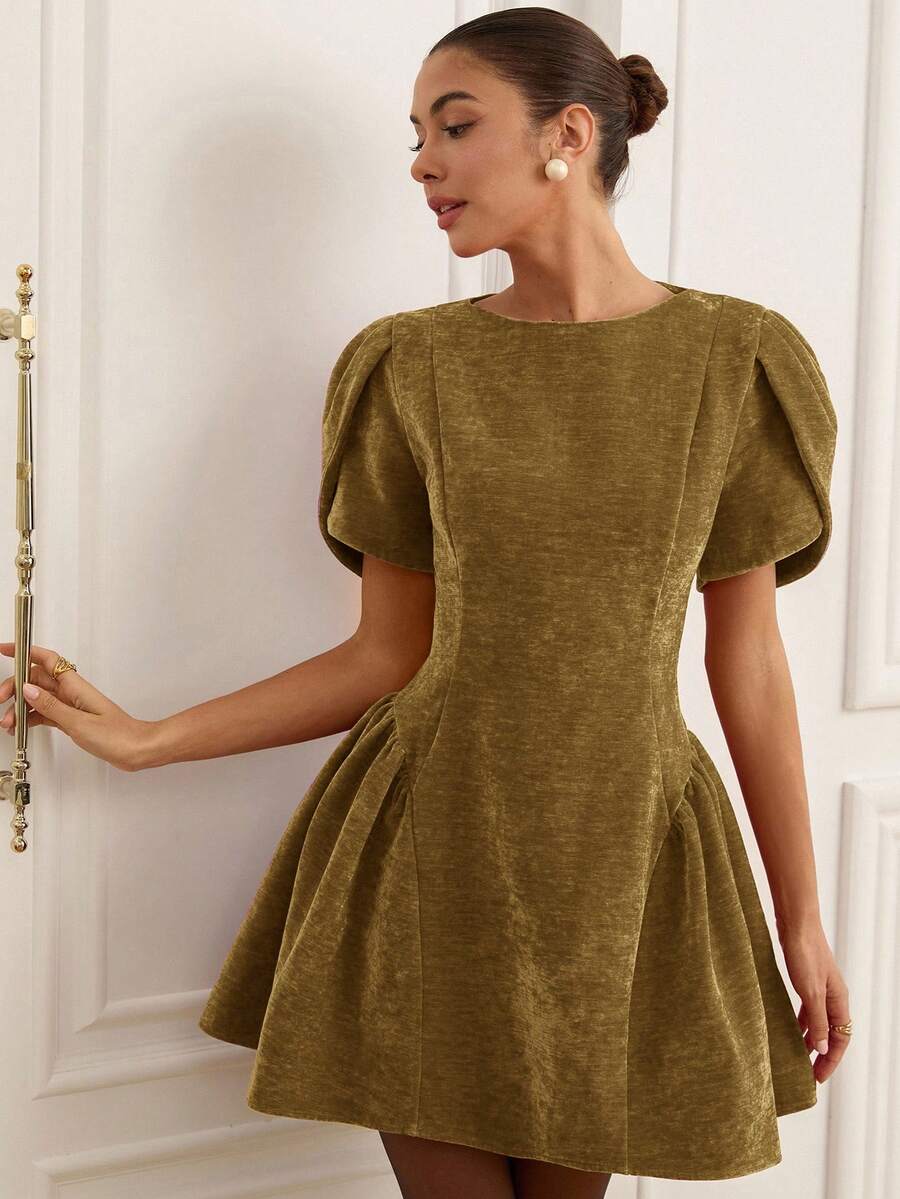 Elevate your wardrobe with this stunning Tulip 3D Graphic Peplum Mini Dress. Featuring a flattering high-waisted A-line silhouette with eye-catching peplum detailing, this dress combines elegance with modern style. The short puff sleeves and round neckline create a feminine, princess-inspired look perfect for night out occasions. Crafted from a durable polyester-elastane blend woven fabric, this olive green dress offers a regular fit with a flared hem. The convenient front zipper makes dressing effortless. 