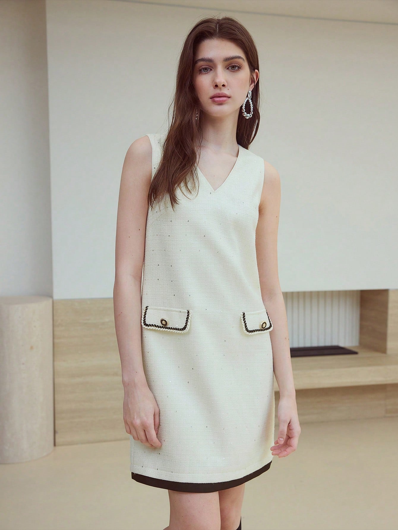 Step out in style with this playful tweed dress featuring eye-catching contrast binding. Perfect for adding a chic twist to your wardrobe, its textured fabric and bold edges create a fun, fashionable look that’s ready for any occasion. Embrace effortless elegance with a touch of flair!