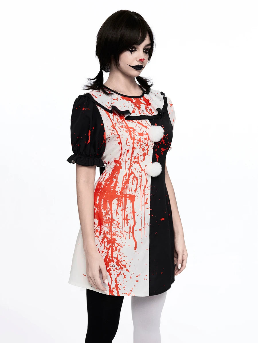 Front view of black white harlequin clown dress with red splatter puff sleeves and pom poms