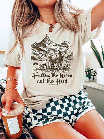 Boost your spirits with our 'Follow His Words' graphic tee, designed with a Western flair. Show off your faith in a playful way with this quirky and stylish tee for women.