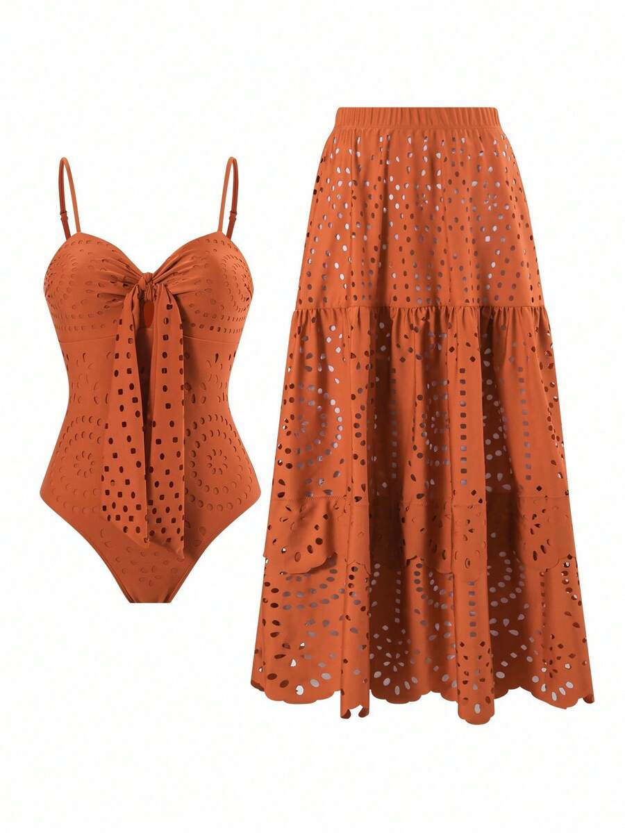 Dive into elegance with this stunning V-neck one-piece swimsuit in rich caramel brown. The intricate hollow-out detailing adds a touch of sophistication and modern flair, creating visual interest while maintaining flattering coverage. The V-neckline elongates the silhouette and offers a chic, contemporary look perfect for poolside or beach days. Crafted for comfort and style, this versatile piece transitions seamlessly from swimwear to resort wear. 
