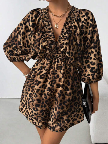 Front angled view of brown leopard V-neck romper with gathered waist and flowing sleeves