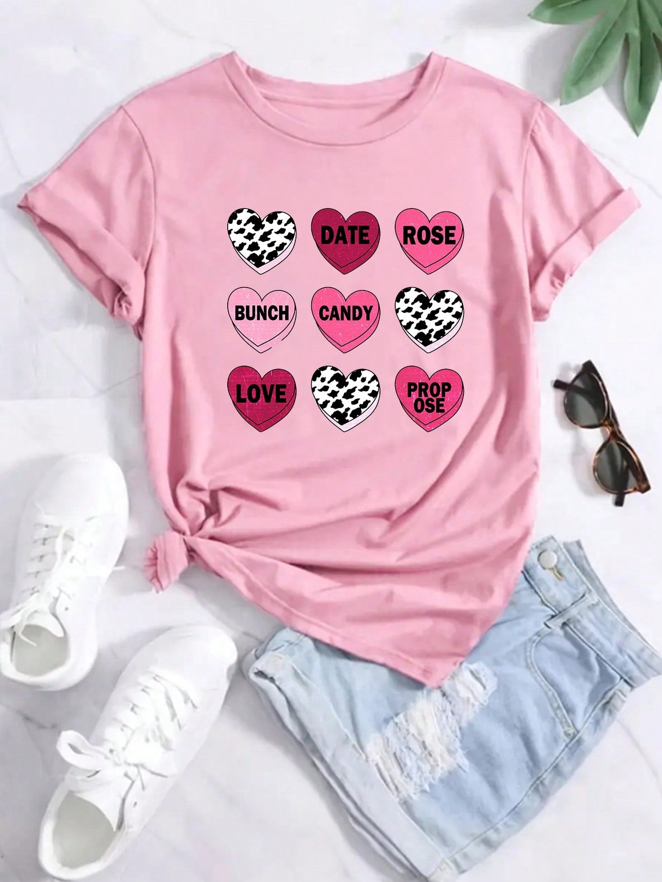 Unleash your playful side this Valentine's Day with our fitted short sleeve t-shirt featuring a heart pattern! Show some love with this quirky top that's perfect for any casual occasion.