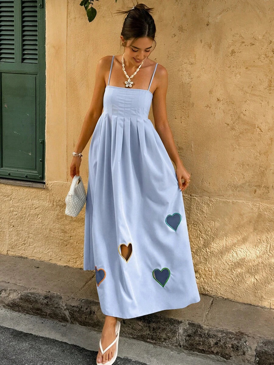 Spread the love this Valentine's Day in our adorable heart print camisole dress! Featuring charming pleated details and a relaxed silhouette, this casual piece is perfect for expressing your romantic side without sacrificing comfort. The lightweight fabric moves beautifully with you, whether you're celebrating with someone special or treating yourself. Pair it with sneakers for a laid-back vibe or dress it up with heels for a sweet date night look. A fun, flirty essential that brings joy to your everyday wa