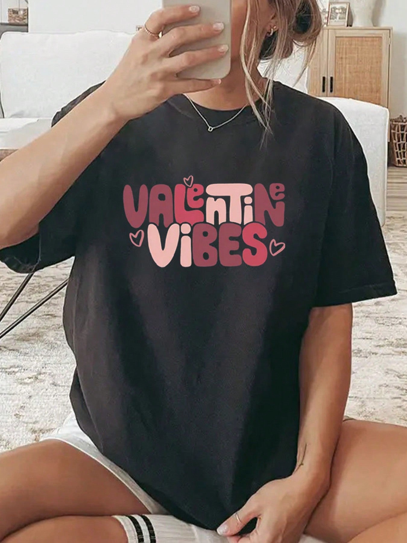 Spread some love with our Valentine's Vibes tee! This trendy graphic tee is perfect for summer and will add a playful touch to any outfit. Show off your fun side with this must-have piece.