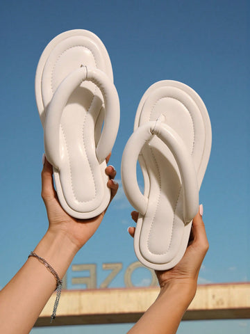Step into summer with these versatile beige thong sandals designed for women who love comfort and style. Featuring a soft bottom and non-slip sole, they keep your feet happy and secure whether you're strolling the boardwalk or dancing at a backyard party. Lightweight and chic, these sandals are your go-to for effortless outdoor fashion all season long.
