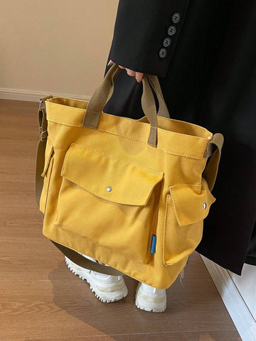 This versatile canvas tote bag is your new go-to for everything from school to work to weekend adventures. With a roomy interior and multiple pockets, it keeps your essentials organized and easy to find. Durable and stylish, it’s perfect for busy days when you need a bag that can keep up with your pace—and your personality!