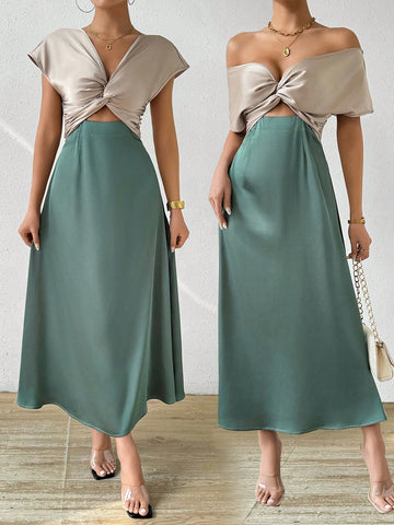 This elegantly designed dress offers versatility, allowing you to wear it in two ways. Its solid color adds a touch of sophistication, while its unique design offers multiple options for styling. Perfect for any occasion, this dress is a must-have for any fashion-forward woman.