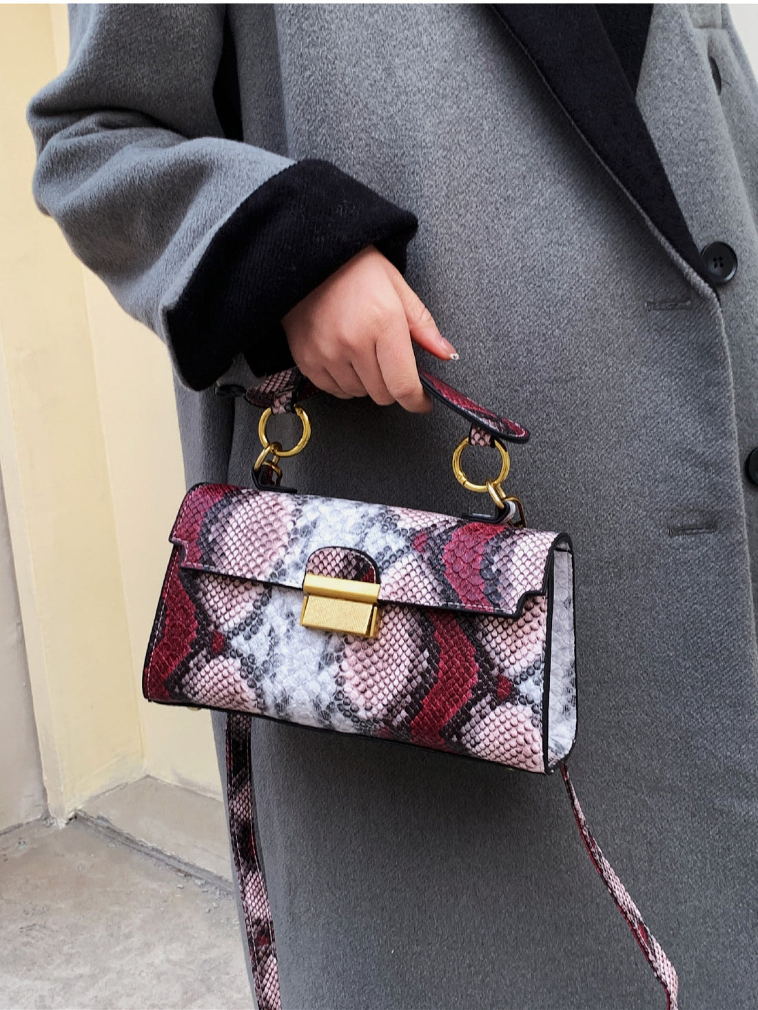 This sleek crossbody bag is the ultimate luxury for stylish women. Made with a versatile snake print design, it adds a touch of sophistication to any outfit. The spacious interior and adjustable strap make it a practical choice for everyday use. Elevate your fashion game with this must-have accessory.