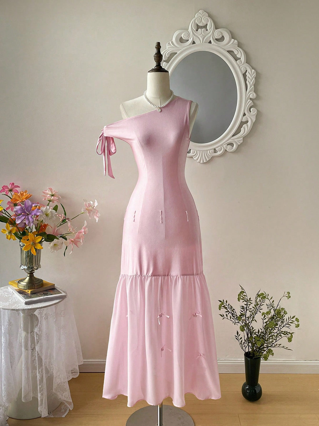 Turn heads with this playful pink bodycon dress featuring an asymmetric bow that adds a fun twist to your look. Perfect for birthdays, festivals, or any elegant event, its flattering fit highlights your silhouette while the unique design brings a touch of whimsy. Celebrate in style and comfort with this versatile dress that’s sure to make every occasion extra special.
