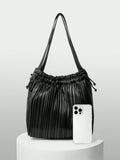 Add a splash of fun to your outfit with this versatile solid color pleated drawstring shoulder bag. Its playful pleats and easy drawstring closure keep your essentials secure while adding a chic twist to your look. Perfect for fashionistas who love style and convenience in one delightful package!