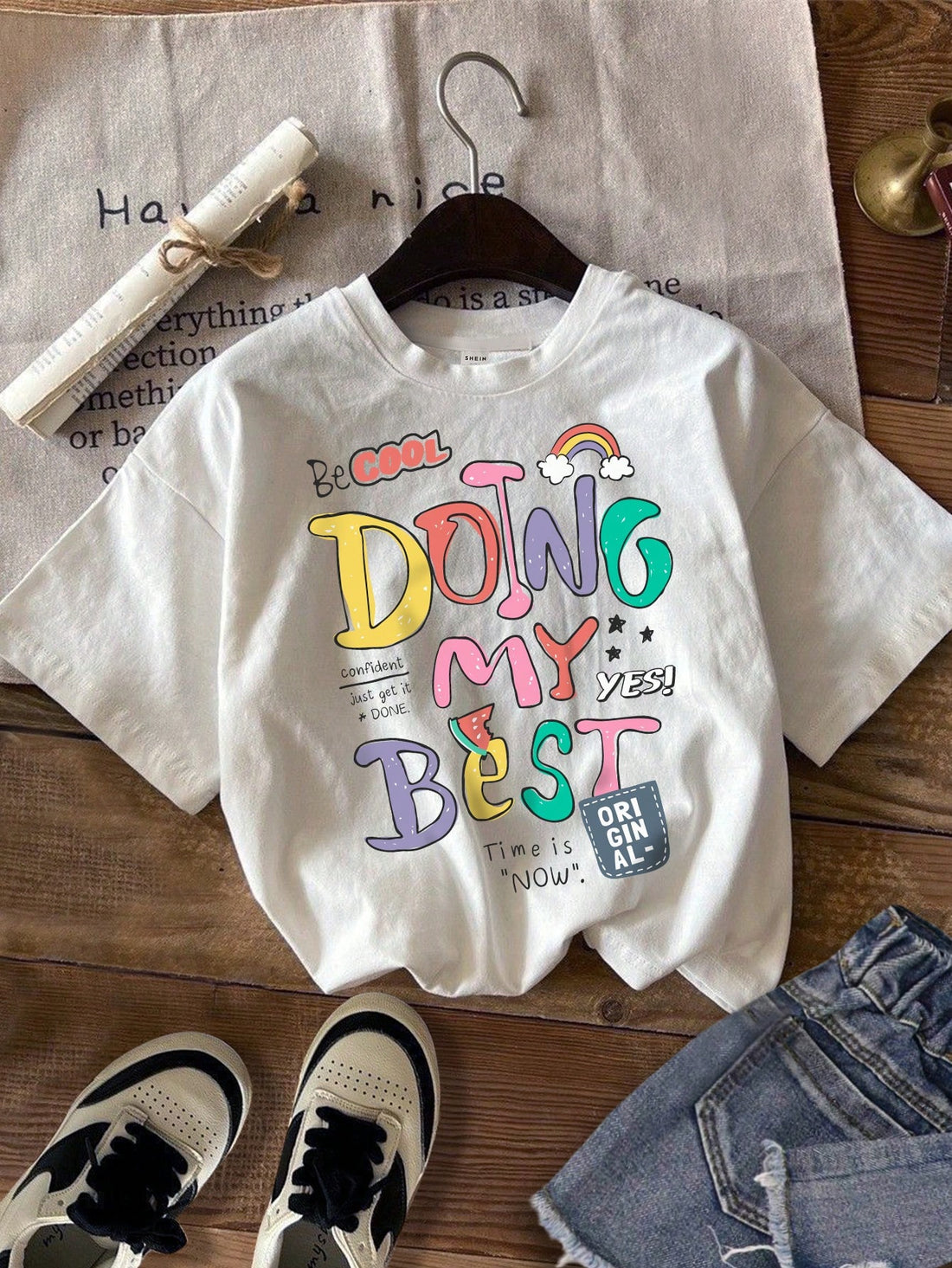 Introducing the Vibrant English Graphic Tee - a trendy, must-have addition to your wardrobe. This casual cotton blend round neck t-shirt for women showcases a vibrant graphic design that is perfect for making a stylish statement. Made with high-quality materials, this tee offers comfort and style in one.