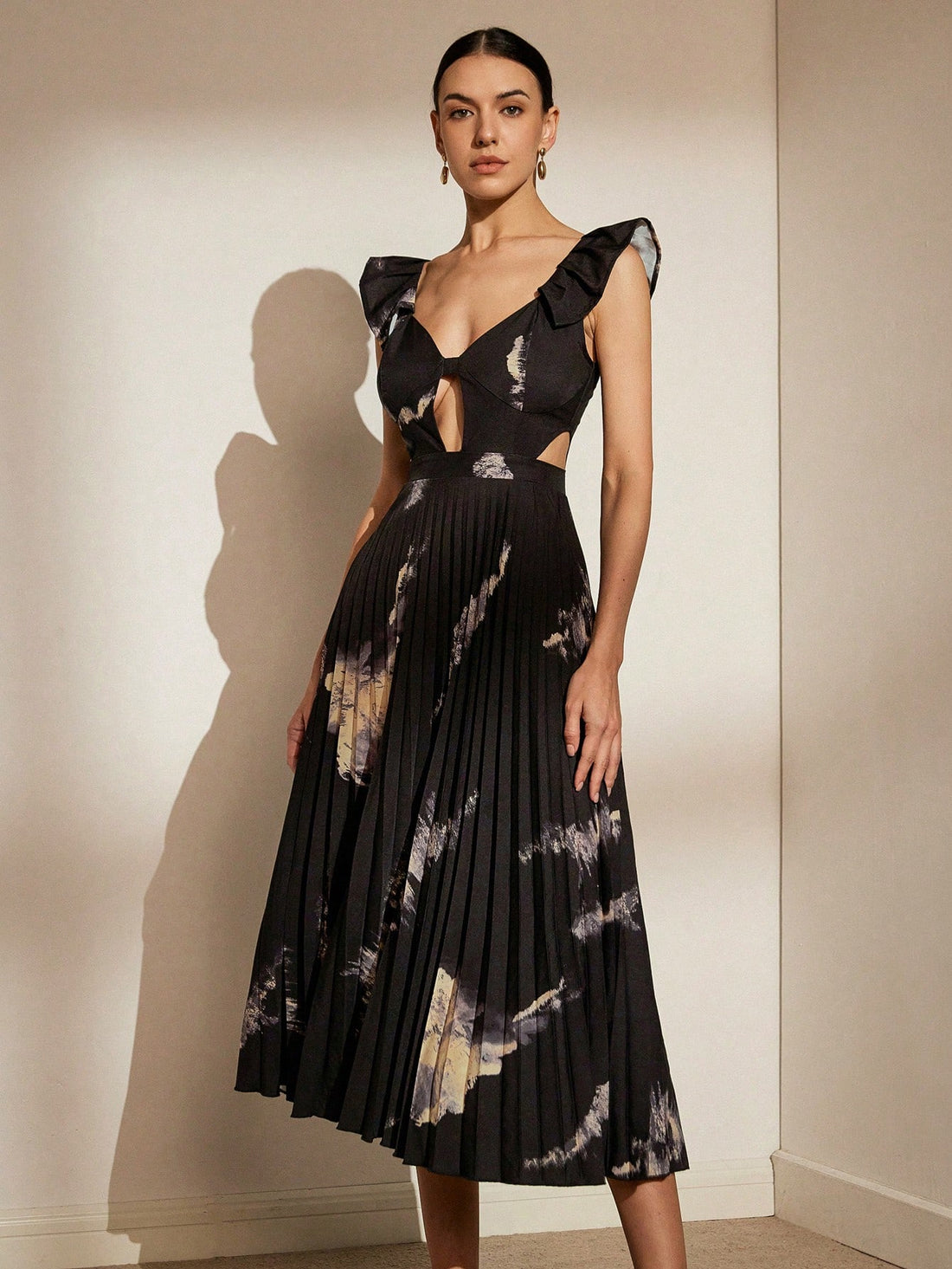 Expertly crafted for your next vacation, the Vibrant Floral Cutout Dress boasts stunning floral patterns and delicate cutouts for a touch of elegance. Stay cool and stylish in this must-have dress, perfect for any warm-weather adventure.