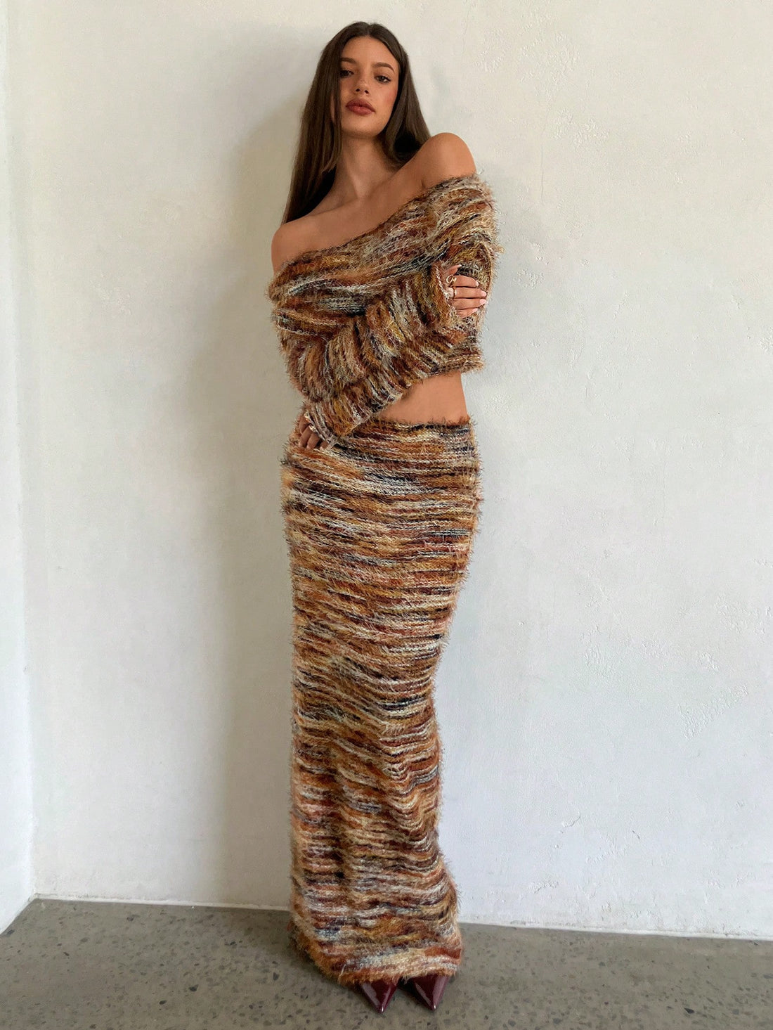 Make a bold statement with this vibrant two-piece set that's all about fun and flair! The off-shoulder long sleeve top features eye-catching colorful yarn details that add texture and personality, while the coordinating skirt completes the look with effortless style. Perfect for turning heads at casual outings, weekend hangouts, or whenever you want to feel confident and colorful. Mix, match, or wear together—this set gives you endless styling possibilities that celebrate your unique vibe.