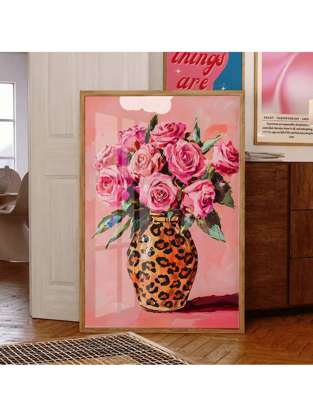 Add a burst of fun and flair to your space with this vibrant pink roses artwork nestled in a fierce leopard print vase. Perfect for anyone who loves girly decor with a bold twist, this maximalist floral print brings playful energy and a pop of color to any room. It’s the perfect piece to brighten up walls and spark joy every time you glance its way.