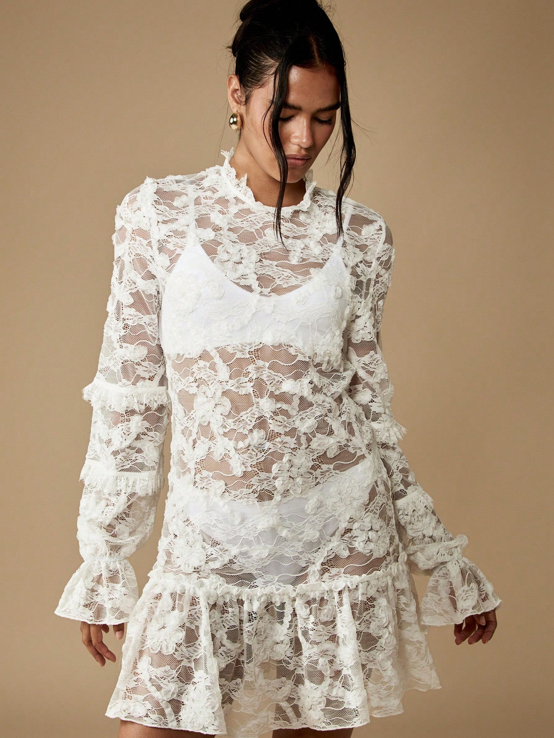Step into timeless elegance with this enchanting Victorian-inspired mini dress, where delicate ruffle lace details meet modern sophistication. Perfect for weddings, honeymoons, and those unforgettable special moments, this dress captures romantic charm with its intricate lacework and flattering silhouette. The playful ruffles add movement and dimension, while the mini length keeps things fresh and contemporary. Whether you're saying "I do" or celebrating love in style, this dress transforms any occasion int