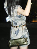 Add a bold touch to your look with this vintage-inspired antique gold chain shoulder bag. Perfect for punk rock vibes or lighting up the party scene, its eye-catching metallic finish pairs effortlessly with edgy or glam outfits. Compact yet striking, this bag keeps your essentials close while making a statement wherever you go. Let your style sing with every step!