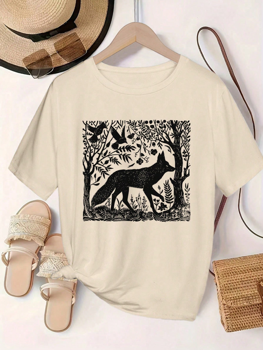 Effortlessly elevate your spring/summer style with our Vintage-Inspired Fox and Bird Print Casual T-Shirt. Featuring a unique, vintage-inspired design, this t-shirt adds a touch of personality to any outfit. Crafted for comfort and style, this t-shirt is perfect for any occasion.