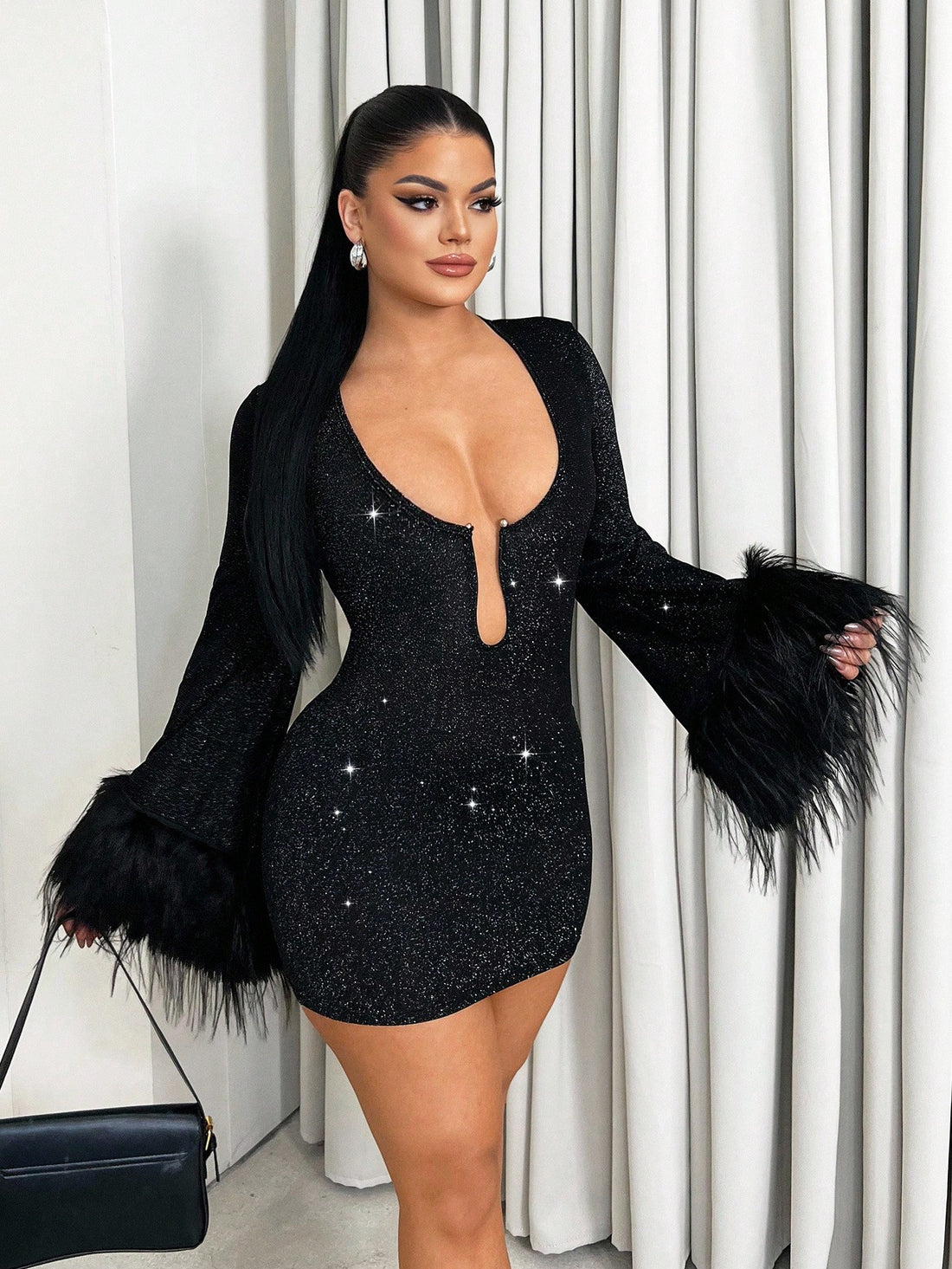 Turn heads at your next event in this vintage-inspired mini dress that blends retro charm with modern edge. The long sleeves provide elegant coverage while the flirty fringe detailing adds movement and personality to every step. Cut to a flattering mini length, this dress strikes the perfect balance between sophisticated and daring—ideal for parties, nights out, or whenever you want to feel confident and fabulous. Slip it on and let the fringe do the talking.