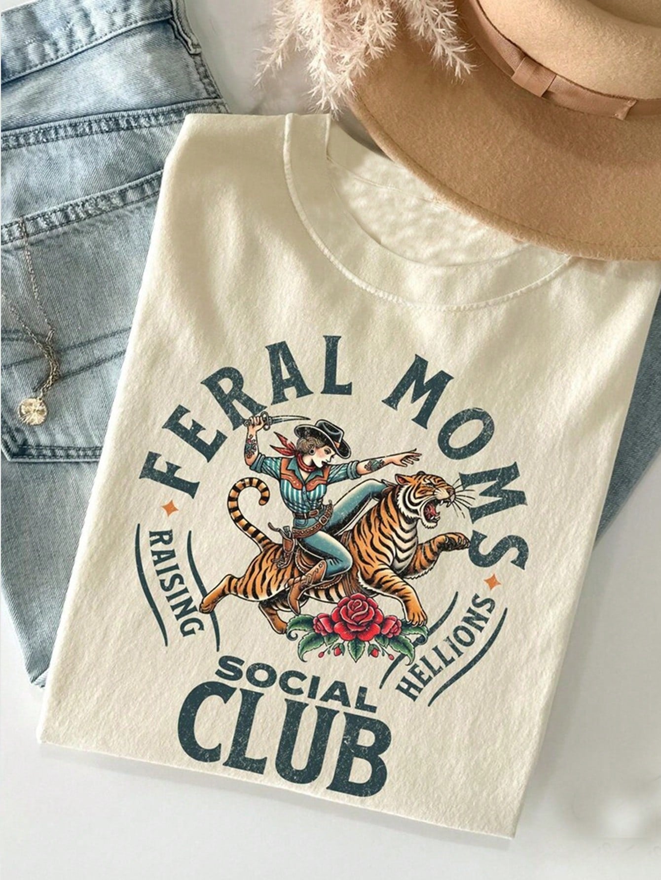 Be the coolest mom on the block with our Vintage-Inspired 'Wild Mom Social Club' Graphic Tee! This chic and comfy tee is perfect for trendy moms who want to make a statement. Bring out your wild side and join the club now! (Limited stock, so don't wait!)