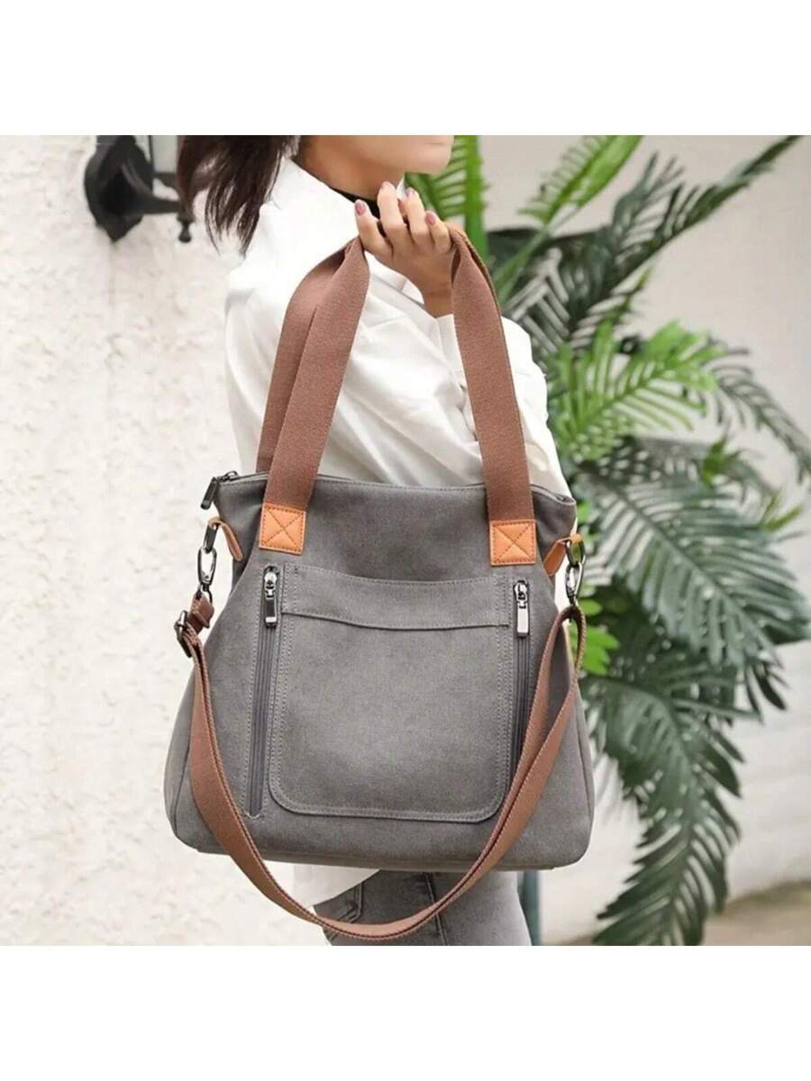 Carry your essentials in style with this vintage-inspired canvas tote! Featuring a roomy interior and a detachable shoulder strap, it’s perfect for everything from market trips to weekend adventures. Durable and charming, this tote adds a playful touch to your everyday look while keeping your hands free and your belongings organized.
