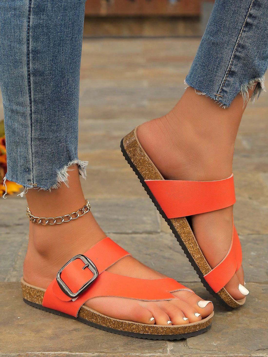 Step into summer with our vintage-inspired flat sandals! These playful thong shoes feature a stylish metal buckle and ultra-comfortable cork sole that molds to your feet. Perfect for beach parties, boardwalk strolls, or just showing off your pedicure! Your feet will thank you for choosing fashion that doesn't sacrifice comfort during those long summer days.