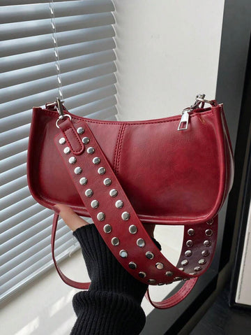 Add a dash of retro charm to your outfit with this vintage-inspired rectangular handbag. Featuring eye-catching rivet accents and a smooth zipper closure, it’s the perfect playful companion for your daily adventures. Comfortable to wear on the shoulder and spacious enough for your essentials, this chic bag brings both style and function to your look.