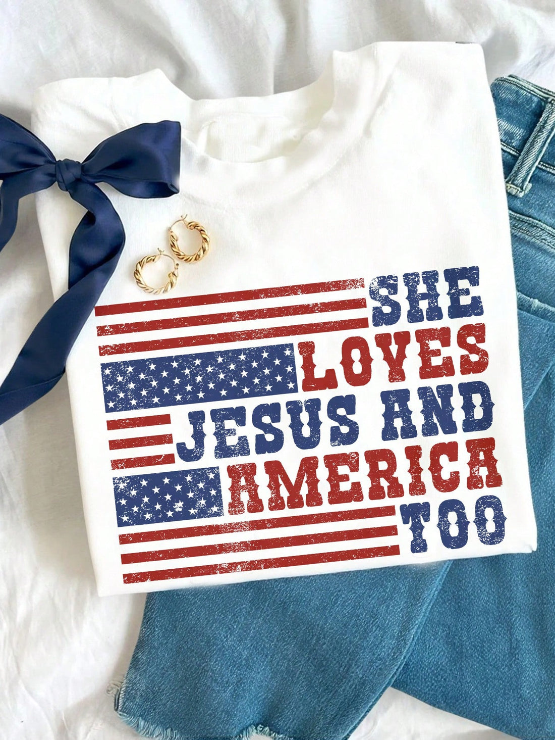 Celebrate your patriotic spirit with this vintage-inspired white tee! Featuring the charming "She Loves Jesus and America" design, this short sleeve shirt is perfect for July 4th festivities or everyday wear. Soft and comfortable, it’s a fun way to show your love for faith and country with a playful, classic vibe.