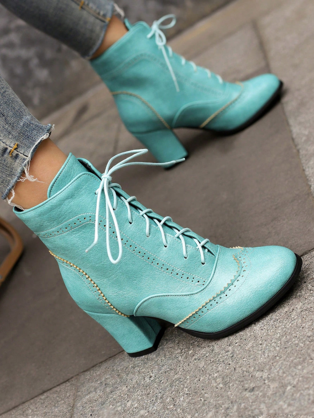 Step into style with our Vintage British-Inspired Blue Lace-Up High Heel Ankle Boots. These boots offer a touch of vintage charm paired with a modern twist. The lace-up design and high heel provide both comfort and style, making them the perfect addition to any outfit. Elevate your fashion game with these boots!