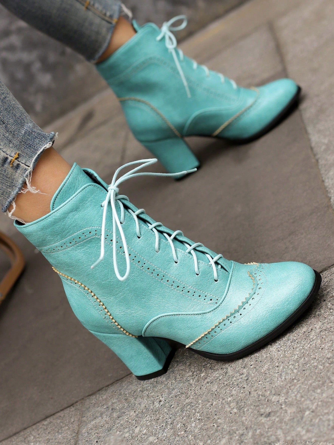 Step into style with our Vintage British-Inspired Blue Lace-Up High Heel Ankle Boots. These boots offer a touch of vintage charm paired with a modern twist. The lace-up design and high heel provide both comfort and style, making them the perfect addition to any outfit. Elevate your fashion game with these boots!