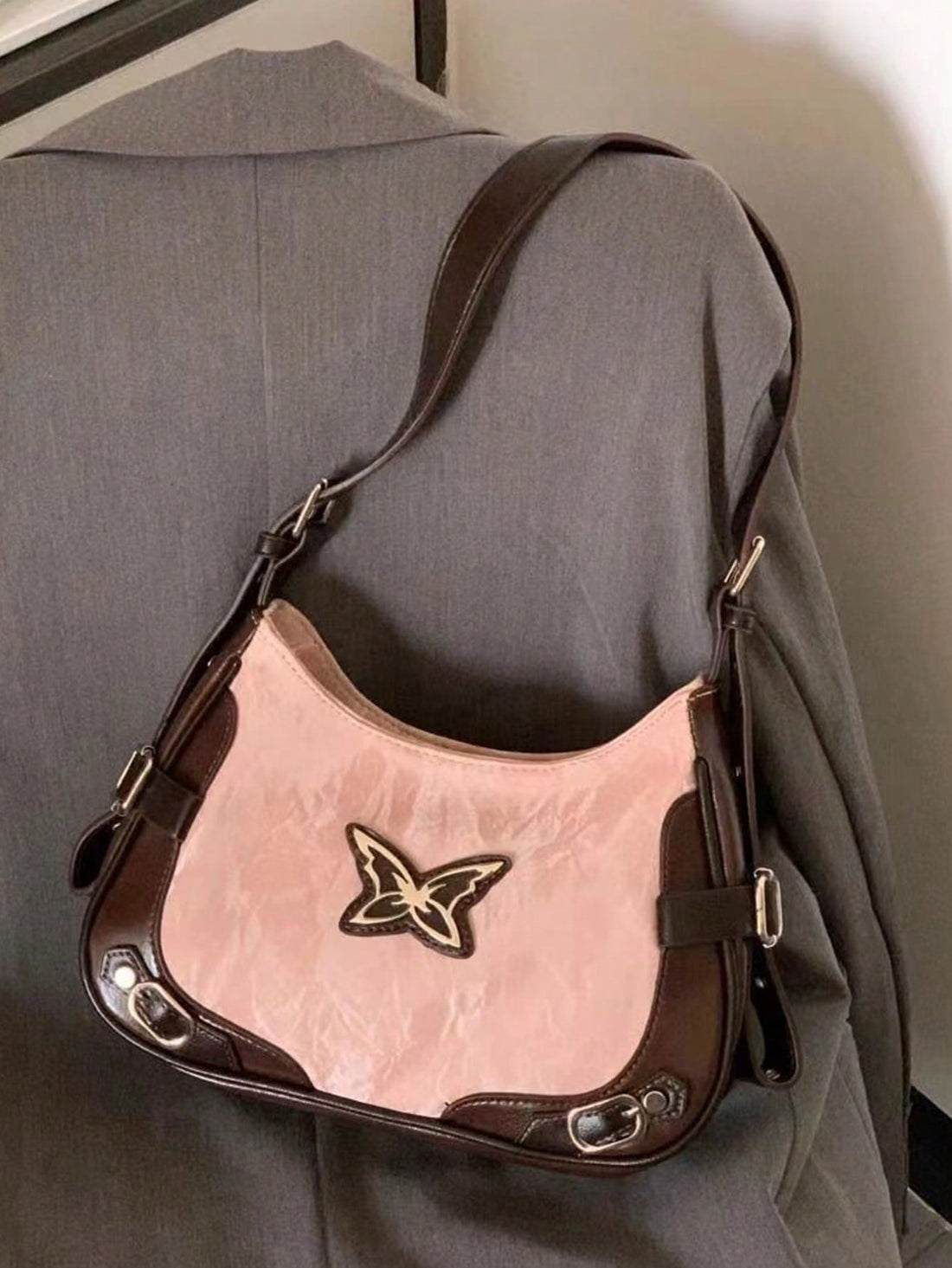 Elevate your style game with the Vintage Chic: Bowknot Studded Motorcycle Armpit Bag. Crafted with high-end American style, this bag features a charming bowknot design and sturdy, studded construction. Wear it effortlessly as a crossbody bag or on your shoulder for an impeccable, edgy look.