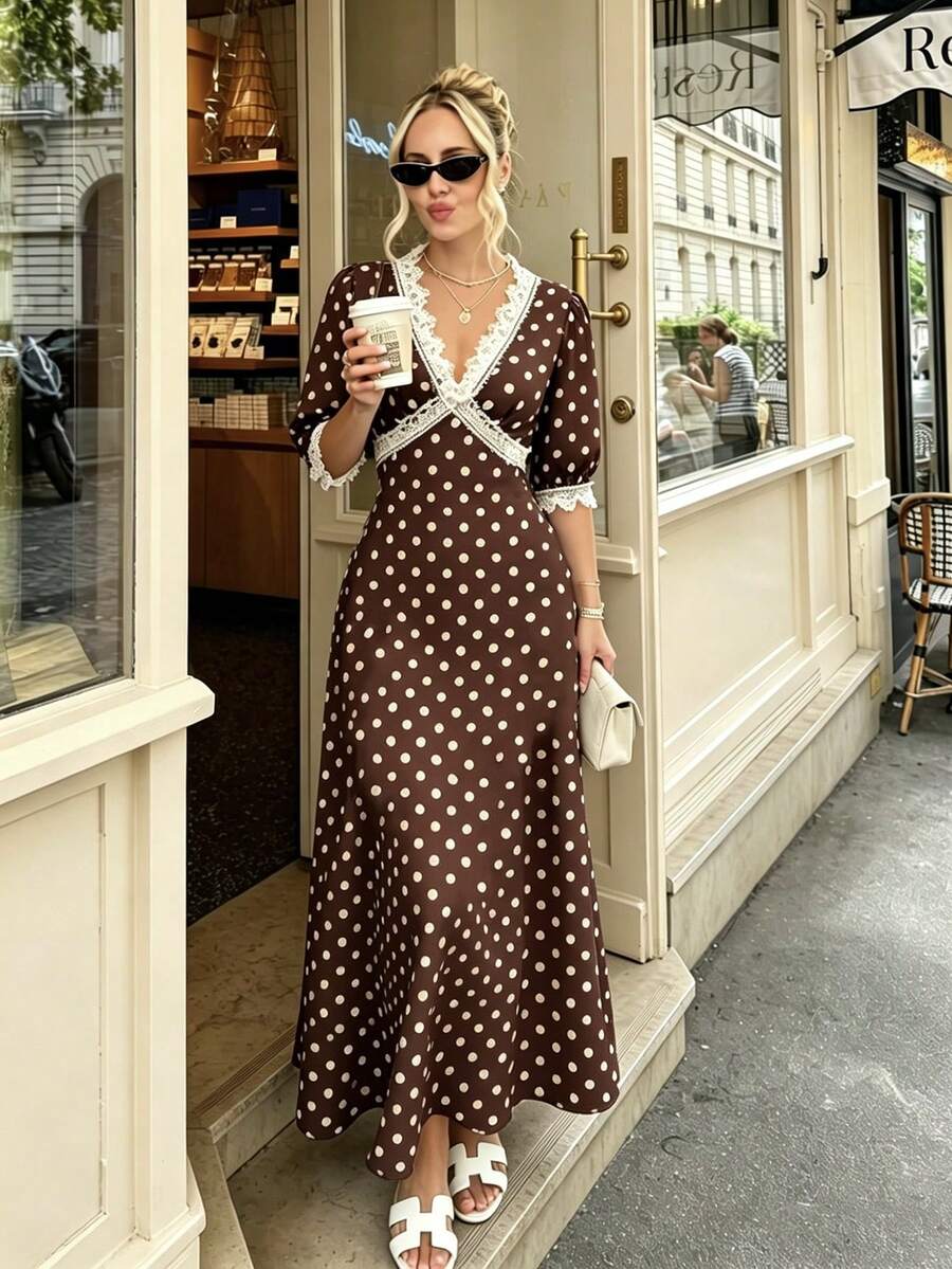 Front view of chocolate brown polka dot maxi dress with lace trim
