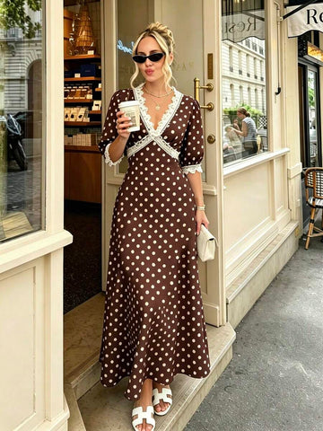 Front view of chocolate brown polka dot maxi dress with lace trim