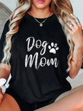 Get ready to rock this Vintage Cotton 'Dog Mom' Classic Tee! Not just your average t-shirt, this one features a fun & stylish paw print design that is sure to turn heads. Comfortable and made with high-quality vintage cotton, this tee is perfect for all the dog moms out there.