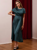 Slip into timeless elegance with this vintage-inspired dark blue satin midi dress, featuring a sophisticated animal print that adds just the right amount of edge to your professional wardrobe. The luxurious satin fabric drapes beautifully, creating a flattering silhouette perfect for fall and winter business casual settings. Whether you're heading to the office or a weekend brunch, this versatile piece transitions effortlessly from desk to dinner. The midi length keeps things polished while the bold print e