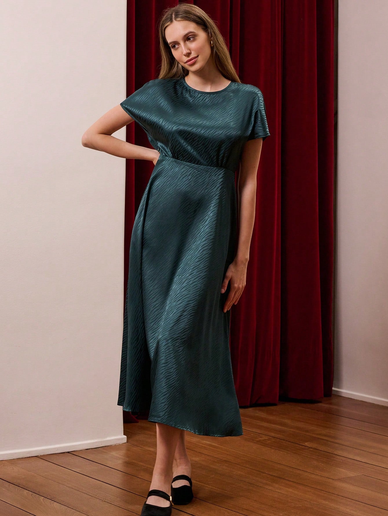 Slip into timeless elegance with this vintage-inspired dark blue satin midi dress, featuring a sophisticated animal print that adds just the right amount of edge to your professional wardrobe. The luxurious satin fabric drapes beautifully, creating a flattering silhouette perfect for fall and winter business casual settings. Whether you're heading to the office or a weekend brunch, this versatile piece transitions effortlessly from desk to dinner. The midi length keeps things polished while the bold print e