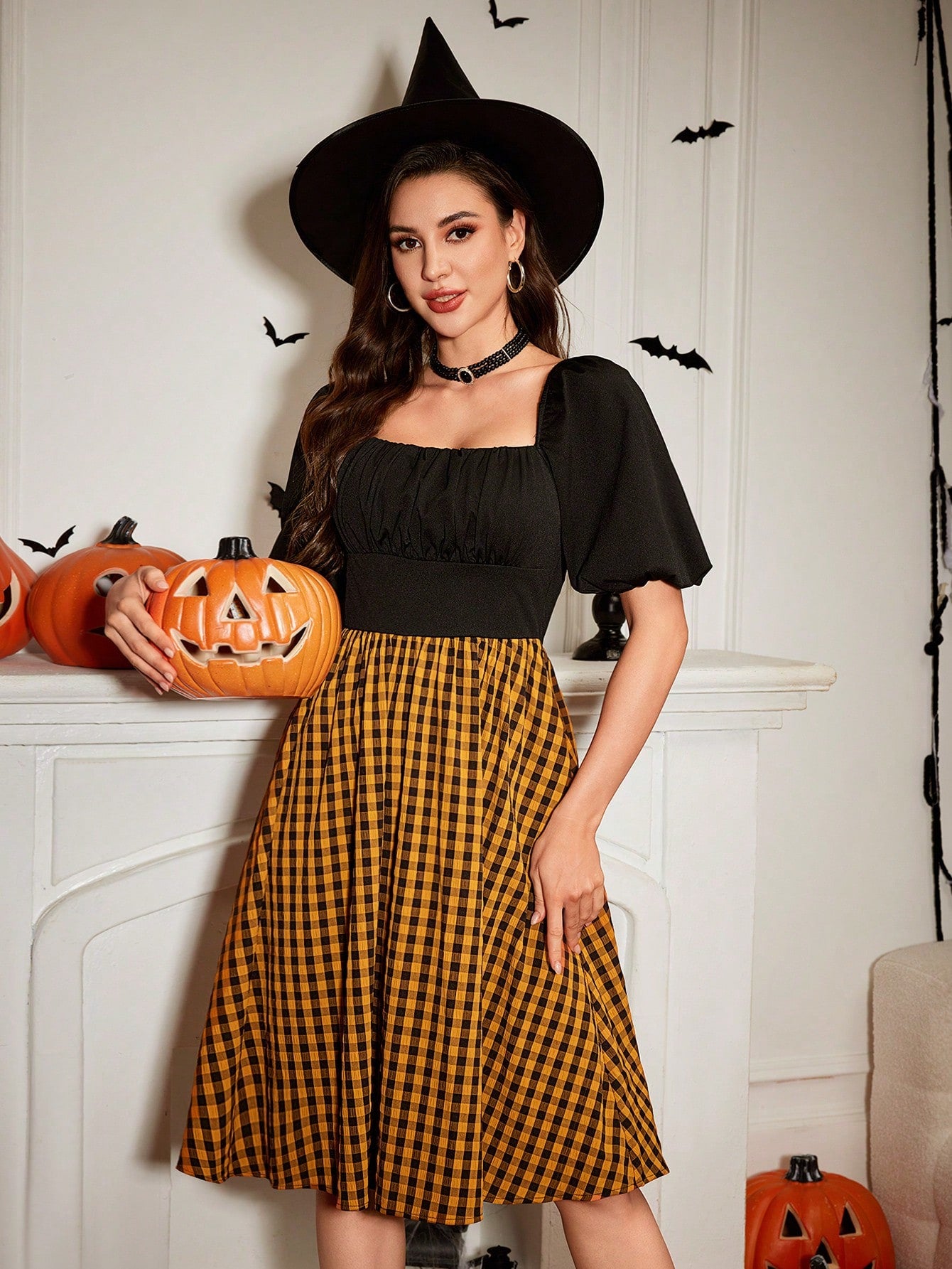 Get ready to turn heads with our Vintage Elegance dress! Perfect for Halloween and Homecoming, this midi dress features puff sleeves and a stunning plaid pattern. Channel your inner retro style while standing out from the crowd. Don't miss out on this must-have piece!