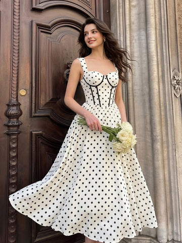 Front view of ivory black polka dot corset midi dress with sweetheart neckline and flared skirt