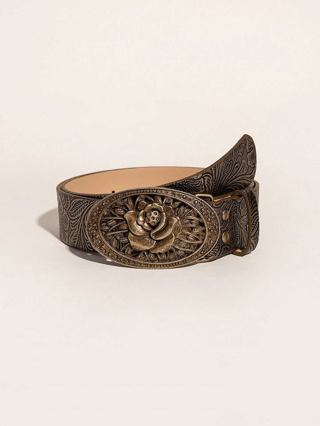 This vintage embossed western cowgirl belt features an elegant rose buckle. Made with high-quality materials, this belt adds a touch of sophistication to any outfit. The embossed design creates a unique and stylish look, while the rose buckle adds a feminine touch. Upgrade your wardrobe with this beautiful and timeless accessory.