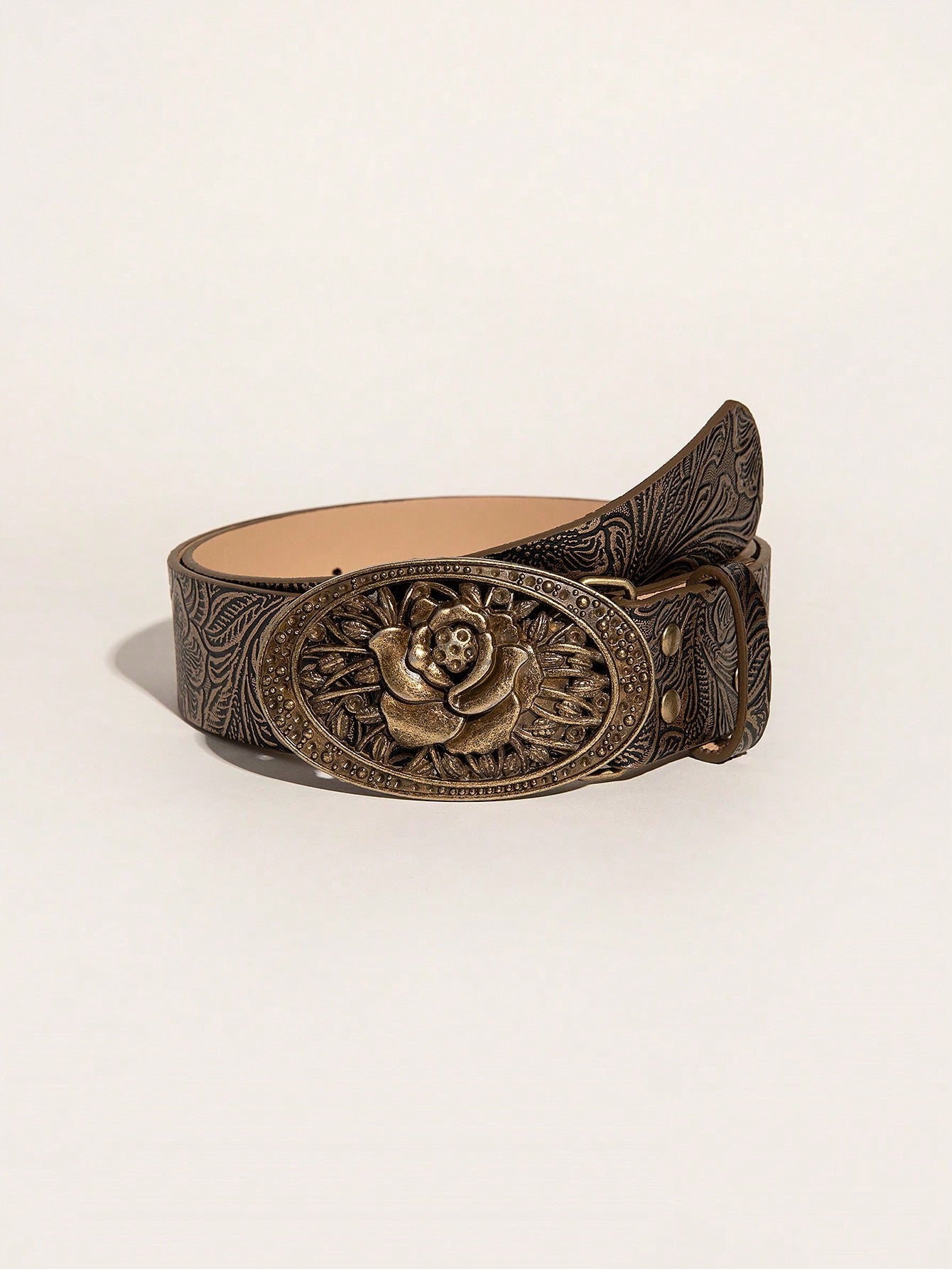 This vintage embossed western cowgirl belt features an elegant rose buckle. Made with high-quality materials, this belt adds a touch of sophistication to any outfit. The embossed design creates a unique and stylish look, while the rose buckle adds a feminine touch. Upgrade your wardrobe with this beautiful and timeless accessory.