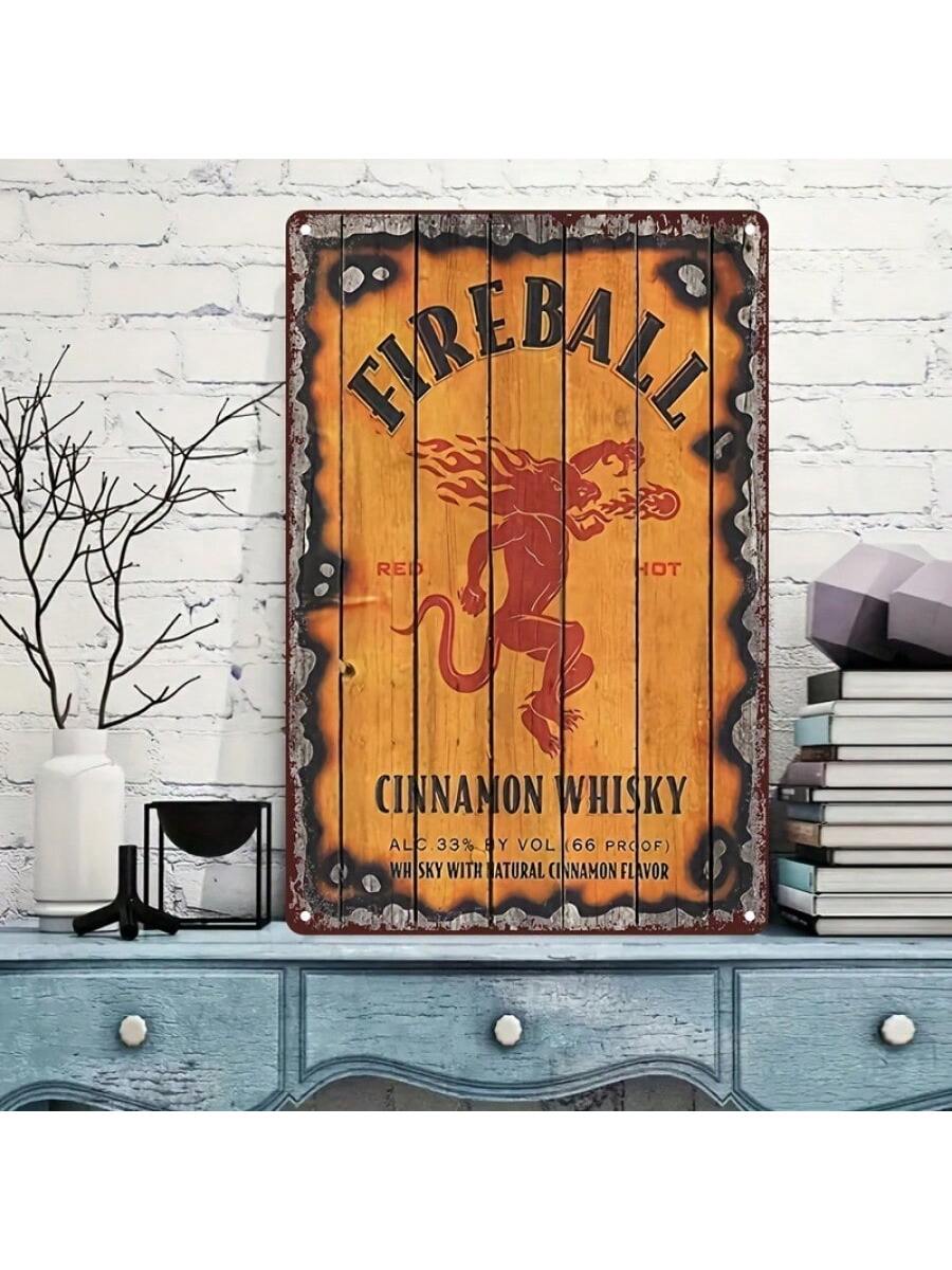 Add some fiery flair to your space with this vintage Fireball Whisky metal tin sign! Perfect for bars, cafes, or even your home decor, this classic wall art is sure to catch the eye of all who see it. Cheers to adding a touch of nostalgia and fun to any room!