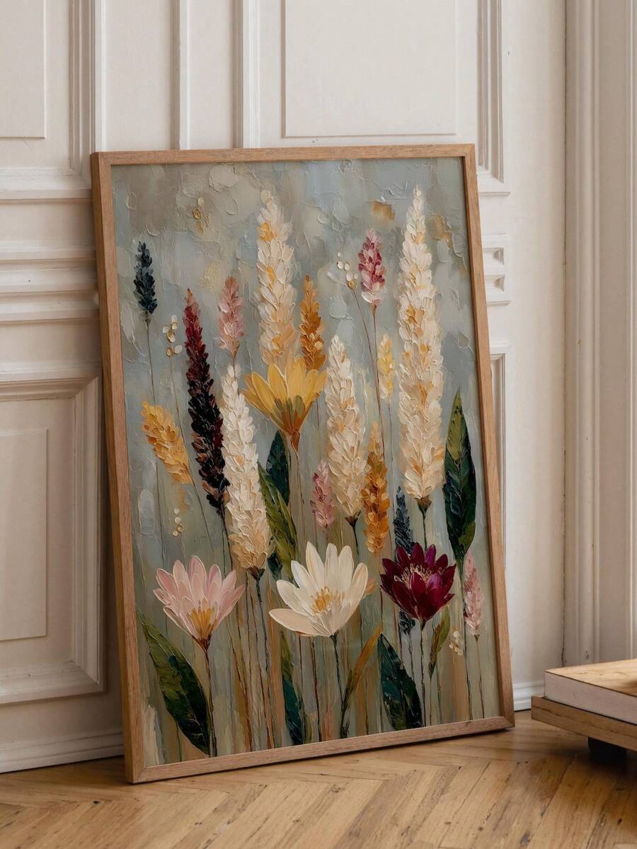 Vintage wildflower canvas wall art in a light wood frame leaning against a paneled wall