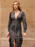 Embrace vintage charm with this enchanting floral ditsy print midi dress, where delicate blooms dance across a sophisticated black and blue palette. The long sleeves and midi length make it an ideal companion for crisp autumn days and cozy winter evenings. Perfect for layering with your favorite cardigan or jacket, this dress effortlessly transitions from casual outings to more polished occasions. The timeless floral pattern adds a whimsical touch to your wardrobe, while the classic color combination ensure
