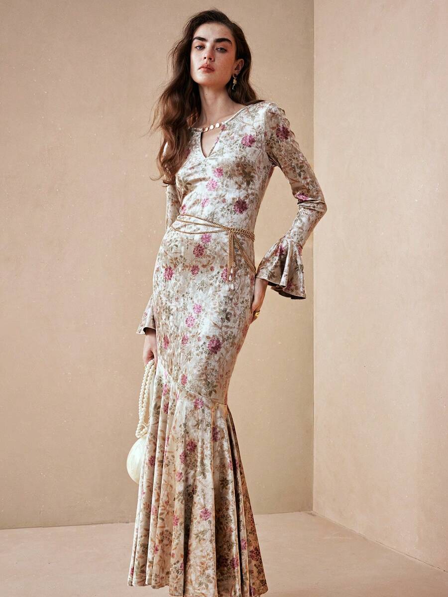 Embrace timeless elegance with this vintage-inspired French ditsy floral dress, perfect for autumn and winter celebrations. Featuring a flattering keyhole neckline, flare sleeves, and a high-waisted silhouette, this slim-fit design showcases a romantic mermaid hem with delicate ruffle detailing. The multicolor botanical print adds sophisticated charm to any formal occasion. Crafted from a comfortable knitted fabric blend of 95% polyester and 5% elastane with medium stretch, this dress moves with you while m