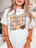 Get ready to gobble up the fun this Thanksgiving with our Vintage Gobble Turkey Shirt! This cute tee brings a playful touch to your festive celebrations, making it perfect for family dinners and holiday gatherings. Its timeless vintage design adds charm, while the soft fabric keeps you comfy all day long. Show off your Thanksgiving spirit in style and spread smiles wherever you go!