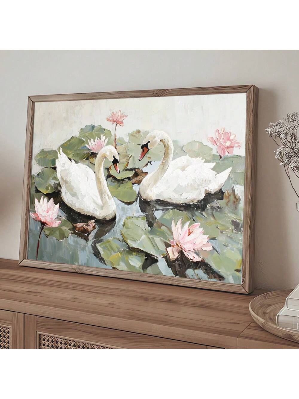 Add a touch of whimsy to your space with this Vintage Lotus Flower and Swans Canvas Print. Its minimalist design blends classic charm with modern flair, making it perfect for brightening up any room. Let these graceful swans and delicate lotus flowers bring a playful yet serene vibe to your home décor.