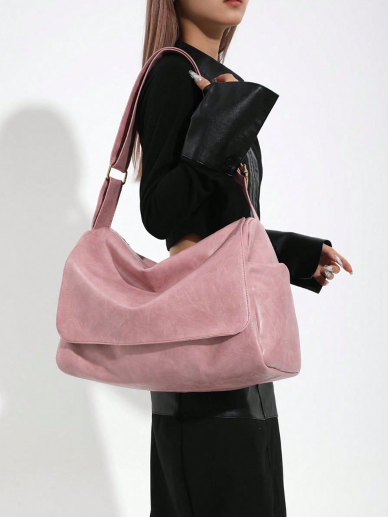 Crafted from supple leather in a timeless pink hue, this crossbody bag seamlessly transitions from day to evening. The generous interior accommodates daily essentials while the adjustable strap allows hands-free carrying at your preferred length. Vintage-inspired detailing adds character without compromising modern functionality. Whether running errands or meeting friends, this shoulder bag delivers both style and practicality in one versatile piece.